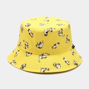 Detailed close-up of yellow bucket hat featuring cat prints and MIAV woven label