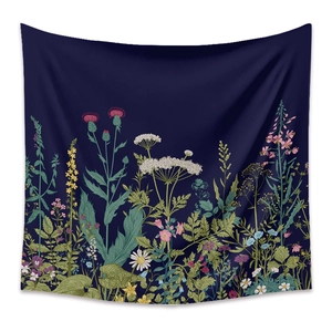 Close-up of deep blue bohemian tapestry showing detailed wild floral prints and fabric texture
