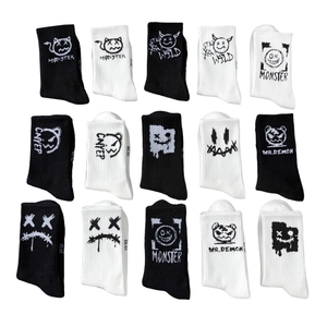 Graffiti style monster graphic mid-calf socks for basketball in black and white knit cotton