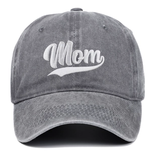 Detailed macro view of Mom embroidery on washed gray cotton twill baseball cap
