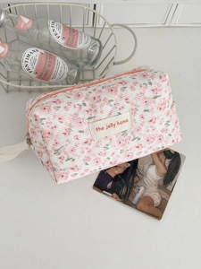 Floral quilted corduroy makeup bag with pink peony pattern and sturdy white handle