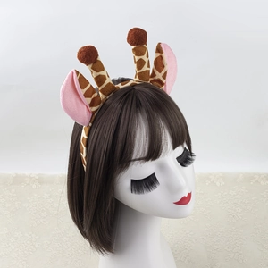 Giraffe headband with plush ears and antlers worn by a model for Christmas parties
