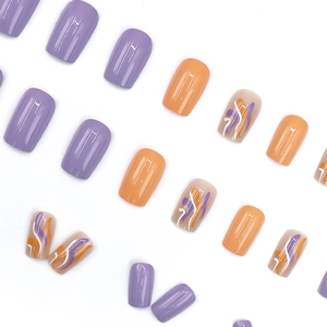 Square wavy press-on nails in purple and orange tones with stylish linear line patterns