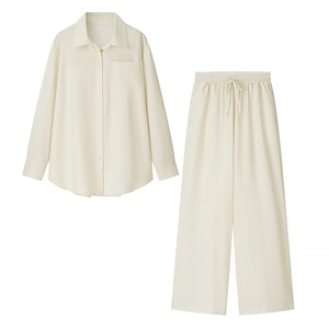 Women's cream loungewear set with ribbed texture and delicate lace trim details