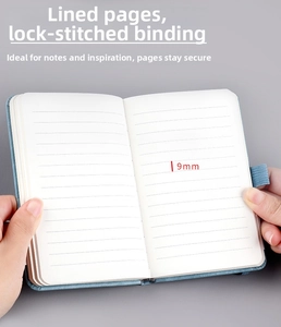 Detailed view of blue leather notebook with 9mm lined paper and secure sewn binding
