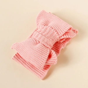Detailed view of pink knitted double-layer bow headband with soft stretch fabric