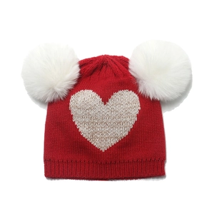 Winter kids knit hat in red with double white faux fur pom poms and silver heart detail