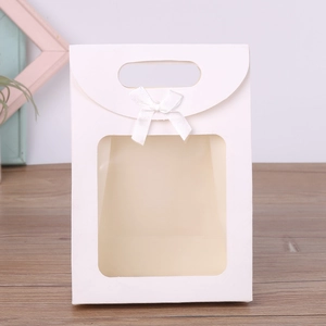 White kraft paper gift bag with trapezoid clear window and ribbon bow decoration