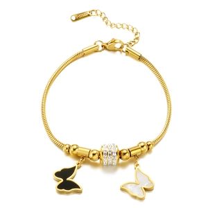 Gold butterfly snake chain bracelet with black and white pendants and rhinestone bead