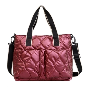 Wine red quilted puffer crossbody bag with glossy finish and adjustable shoulder strap