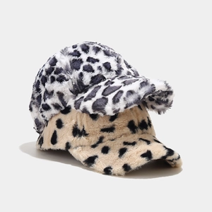 Close-up of winter leopard print plush baseball caps showing soft faux fur fiber texture