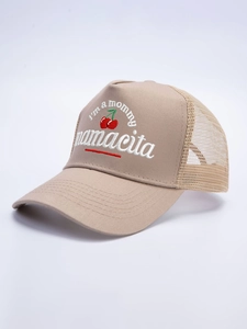 Close-up of beige trucker hat featuring embroidered I'm a mommy text and red cherries