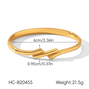 Detail view of 18k gold plated stainless steel knot bangle with size and weight specs