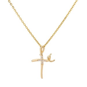Detail of gold cross pendant with micro-pave cubic zirconia on a minimalist chain