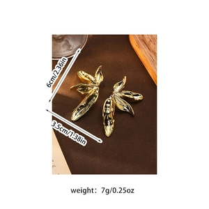 Detailed view of vintage gold petal earrings with size measurements and weight info