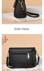 Detail view of black lychee grain leather bag showing back zipper pocket and gold hardware