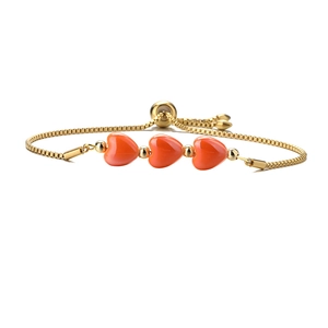 Adjustable golden box chain bracelet featuring three orange ceramic heart charms on white
