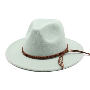 Detail of light mint green wool fedora hat featuring a brown braided leather band