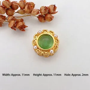 Detail of 11mm vintage gold bead with green cat-eye stone and pearls for DIY jewelry