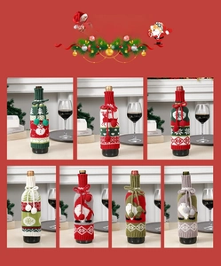 Detail of Christmas wine bottle covers featuring knitted snowflake and Santa Claus motifs