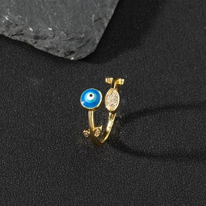 Macro detail of adjustable evil eye ring with blue enamel and sparkling zircon stones