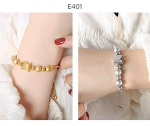 Detailed view of gold and silver beaded butterfly bracelets with adjustable chains