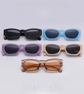 Five styles of retro narrow cat-eye sunglasses in black, blue, purple, beige, and brown