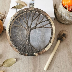 Top view of handmade Shaman drum featuring Tree of Life pattern and wooden drumstick
