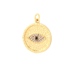 Detailed macro view of gold textured round pendant with inlaid evil eye crystals