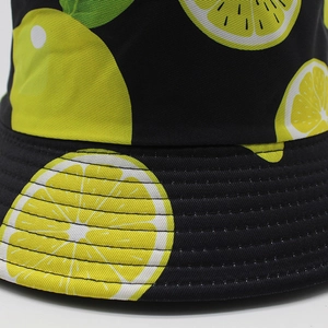 Tropical lemon print bucket hat with black background and detailed brim stitching