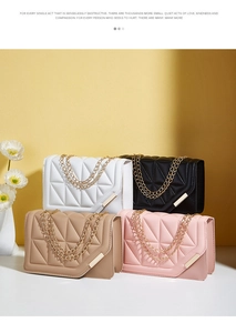 Detail of elegant chain shoulder bags featuring geometric quilted patterns and gold metal bars