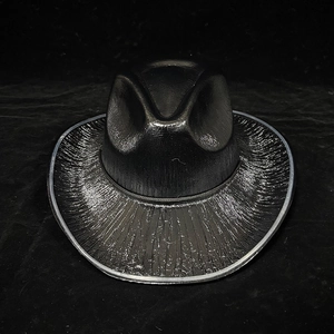 Detail of black metallic cowboy hat with radiant texture for Halloween party