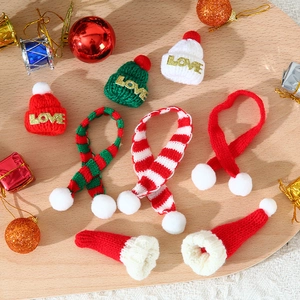 Christmas mini knitted hats and scarves set with gold Love embroidery on festive background