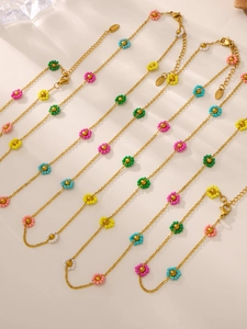 Close-up of colorful beaded flower necklaces with durable stainless steel gold chains