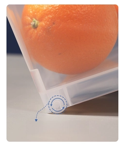 Detail shot of a clear storage bin with integrated bottom wheels for easy movement