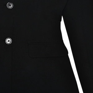 Detail of black blazer waist area featuring two round buttons and a flap side pocket