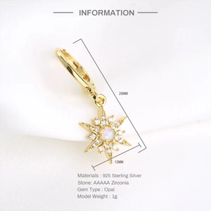 Detail of 925 sterling silver star earrings featuring opal center and zirconia stones