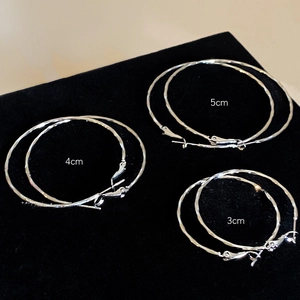 Three pairs of silver twisted hoop earrings in three sizes: 3cm, 4cm, and 5cm diameters