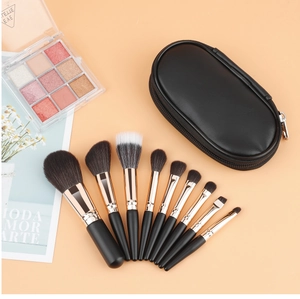 Detailed flat lay of a 9-piece makeup brush set with rose gold ferrules and black PU case