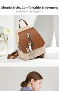 Detailed view of color-block PU leather backpack with cute bunny pendant and zipper