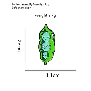 Détail du pin's émaillé cosse de pois avec dimensions 2,6cm x 1,1cm et son poids