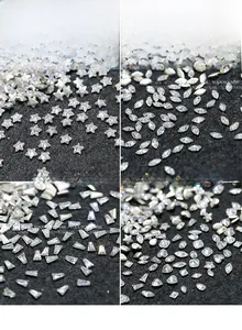 Macro view of flat bottom 5A zircon nail art crystals in star and marquise shapes