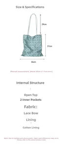 Detailed view of light blue lace tote bag with bow, dimensions 36x37cm and inner pockets
