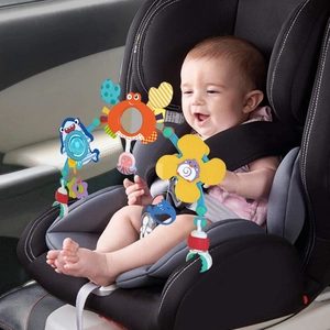 Hanging stroller toy with marine animal pendants on a car seat for baby development