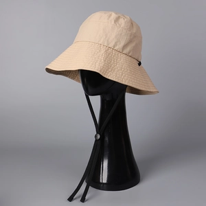 Detail of wide brim sun hat with adjustable drawstring and reinforced stitching
