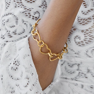 Classic 18K gold-plated stainless steel heart chain bracelet with toggle clasp on model
