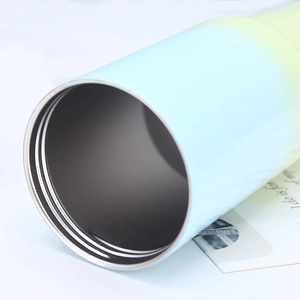 Detailed macro view of the double-walled gradient stainless steel tumblers wide opening