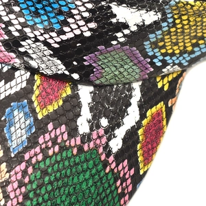 Macro view of colorful snakeskin texture on breathable PU leather visor hat brim
