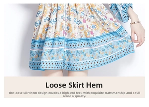 Detail of light blue floral print maxi dress with paisley patterns and pleated hemline