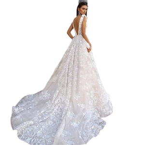 Elegant white backless wedding dress with floral embroidery and long cathedral train